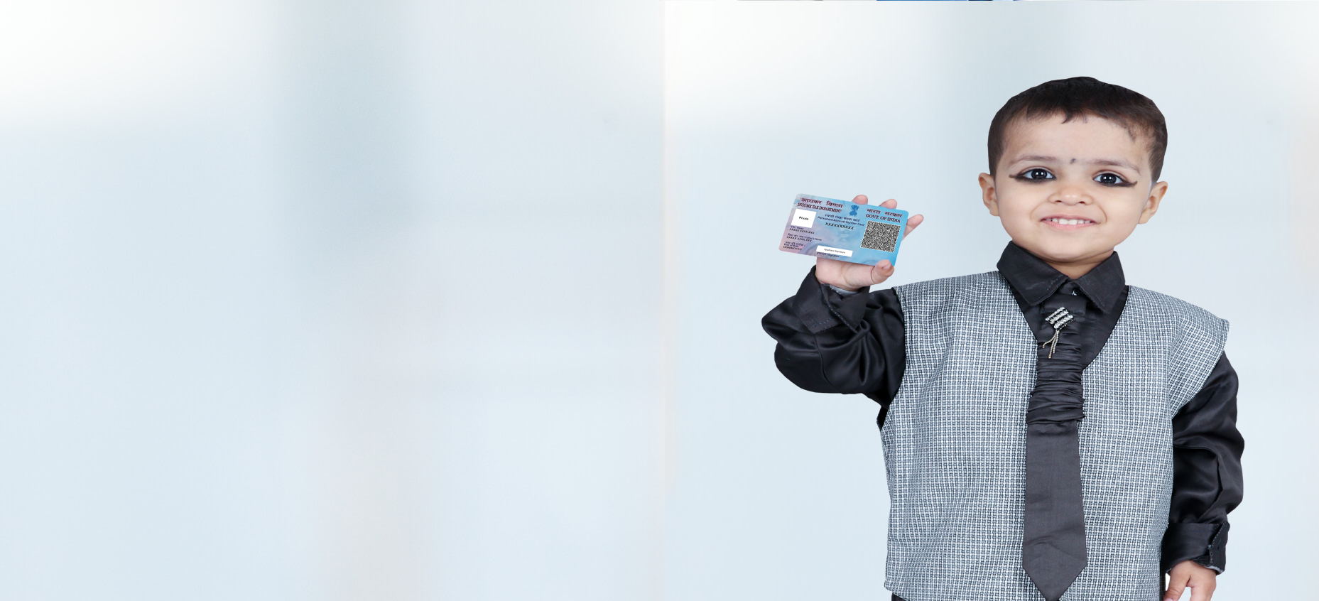Smiling child holding a card
